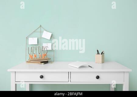 Modern stylish workplace near color wall Stock Photo