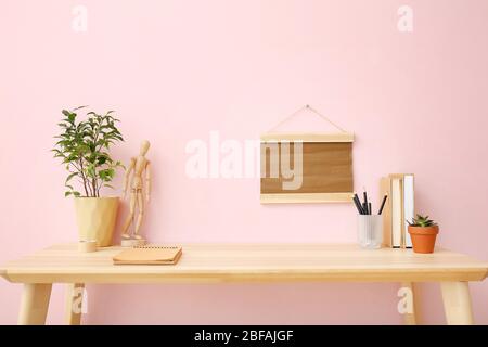 Modern stylish workplace near color wall Stock Photo