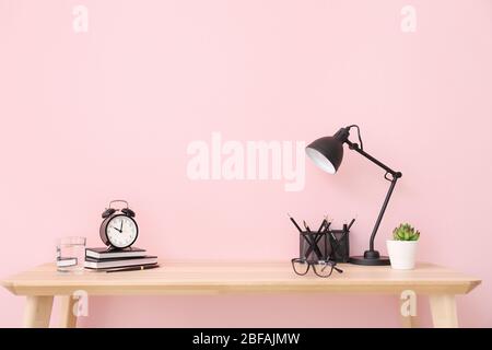 Modern stylish workplace near color wall Stock Photo