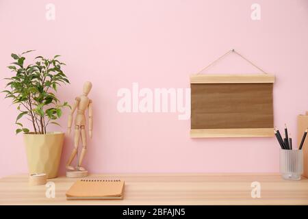 Modern stylish workplace near color wall Stock Photo
