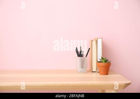 Modern stylish workplace near color wall Stock Photo