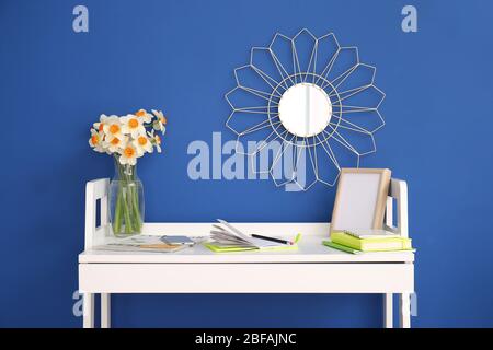 Modern stylish workplace near color wall Stock Photo