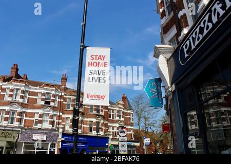 banners in haringey tell the public to stay home and save lives during the corona pandemic lockdown in london england UK Stock Photo