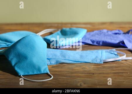 Different medical masks on table Stock Photo