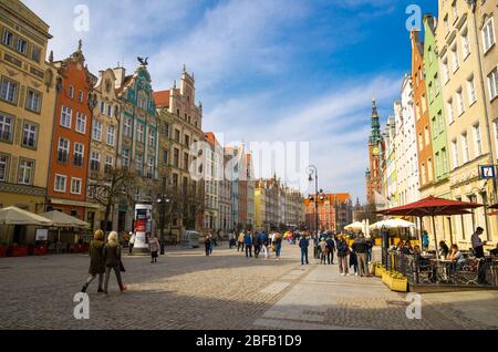 Gdansk, Poland, April 15, 2018: City Hall with spire and facade of beautiful typical colorful houses buildings at Dluga Long Market pedestrian street Stock Photo