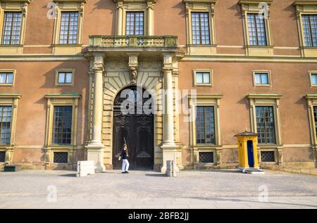 Sweden, Stockholm, May 29, 2018: Guard soldier at post near central enter facade Swedish Royal Palace official residence of King of Sweden in old hist Stock Photo