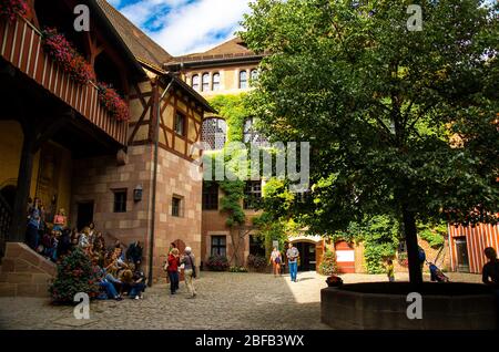 Nurnberg, Germany - September 16, 2016: Courtyard of old medieval castle Heathen Tower Kaiserburg in the city of Nuremberg Nurnberg, Mittelfranken reg Stock Photo