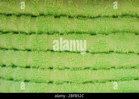 Score. Shelves with towels. Bath accessories. Terry towels are beautiful neat stacks. Colour. Life style. Texture. Organization of space. Flying lady. Stock Photo