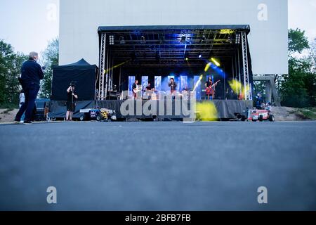 Cologne, Germany. 17th Apr, 2020. The rock band 'Brings' plays a live concert in a drive-in cinema. Credit: Rolf Vennenbernd/dpa/Alamy Live News Stock Photo