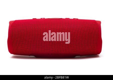 Modern bluetooth red music speaker isolated on white background. Stock Photo