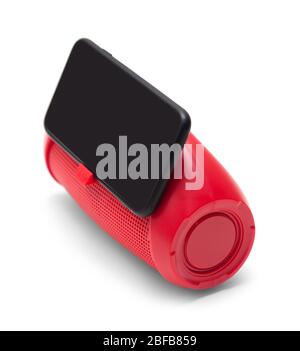 portable red mobile phone speaker boombox with phone stand and smarthone isolated on white background side view Stock Photo