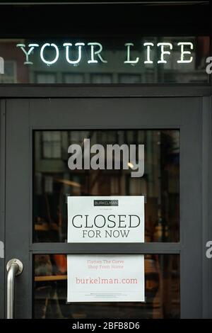 A closed sign in a small business in New York City during the COVID-19 pandemic. Stock Photo