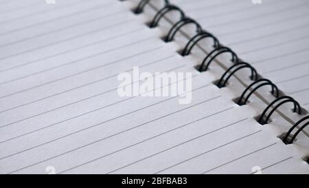 Close up top view of spiral notepad paper background. Stock Photo