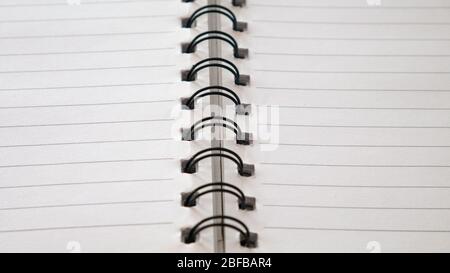 Close up top view of spiral notepad paper background. Stock Photo