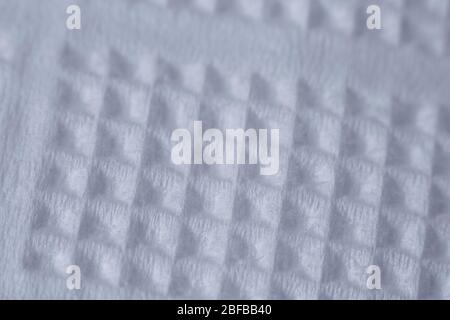 Extremely close-up texture of white paper napkin or towel, natural background, selective focus Stock Photo