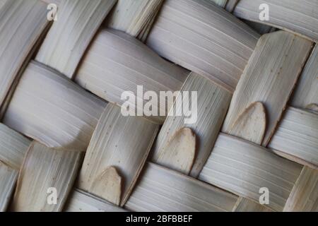 Abstract close-up natural brown woven wood bamboo texture backdrop, selective focus Stock Photo
