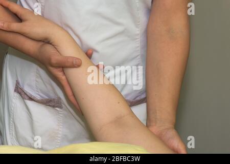 Manual Lymphatic Drainage (MLD) is a Part of complete decongestive therapy (CDT) to reduce edema, control and management Lymphedema. Gentle massage, R Stock Photo