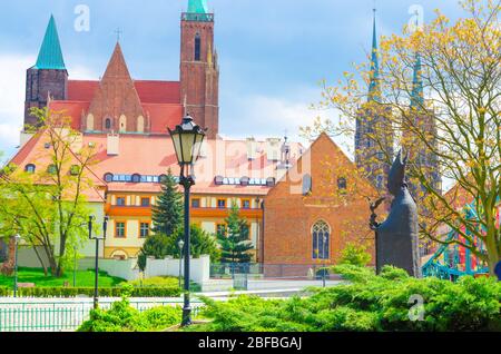 Monument in park on Sand island. Sts. Peter and Paul church, Collegiate Church of Holy Cross and St. Bartholomew, Cathedral of St. John the Baptist in Stock Photo