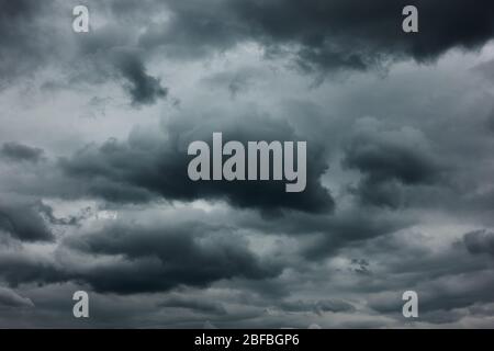 Dramatic sky with dark stormy clouds, may be used as background Stock Photo