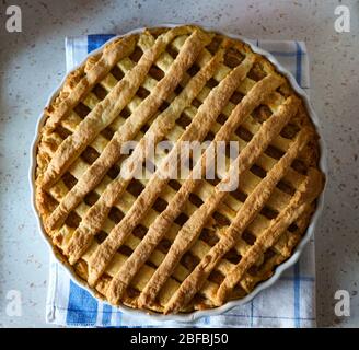 Freshly baked, home made apple pie, lying on the kitchen counter Stock Photo