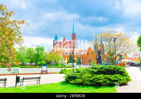 Monument in park on Sand island. Sts. Peter and Paul church, Collegiate Church of Holy Cross and St. Bartholomew, Cathedral of St. John the Baptist in Stock Photo