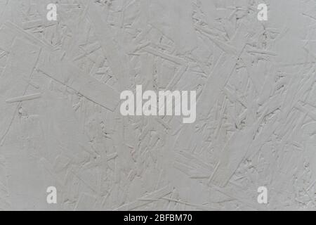 OSB Plywood pressed wood painted in white close up texture Stock Photo
