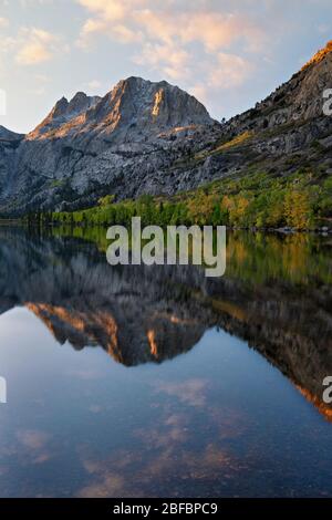 Autumn reflection at first light of Eastern Sierra Mountains into Silver Lake along California’s June Lake Loop and Mono County. Stock Photo