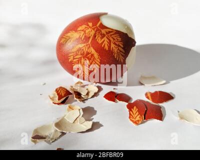 Broken eggshell painted Easter egg isolated on the white background Stock Photo