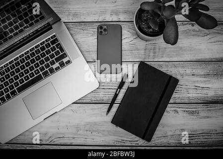 Working from home during Corona Virus lockdown, minimalist desk flat lay on bleached board desktop Stock Photo