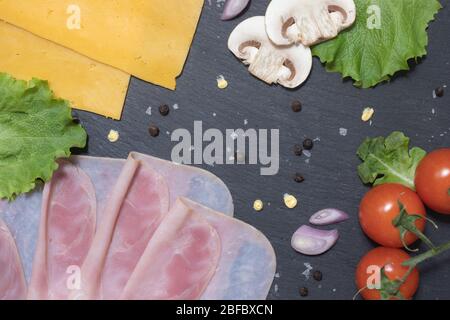 Fresh tasty hamburger ingredients with cheese and mushrooms Stock Photo