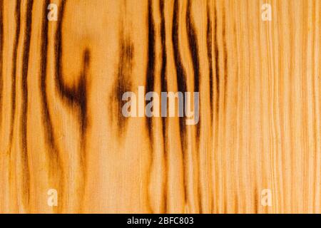 Background texture from burned brown pine wood. Stock Photo