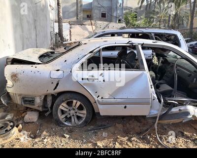 Tripoli, Libya. 17th Apr, 2020. Photo shows damaged cars after a shelling in Tripoli, Libya, April 17, 2020. Indiscriminate shelling on Friday hit residential areas in different parts of Libya's capital Tripoli, killing two civilians, a local official told Xinhua. Credit: Hamza Turkia/Xinhua/Alamy Live News Stock Photo