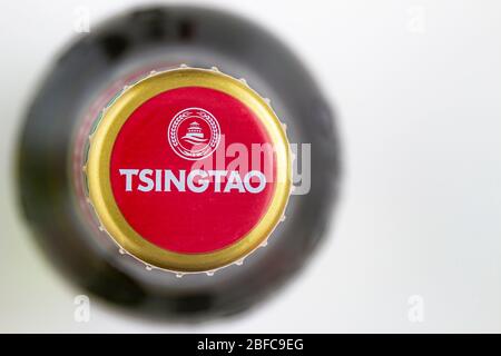 Calgary, Alberta, Canada. April 17, 2020. Top view of a Tsingtao Beer bottle beer cap. Stock Photo