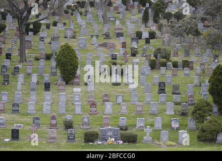 Bronx, United States. 17th Apr, 2020. Tombstones are side by side at Woodlawn Cemetery in the Bronx Borough of New York City on Friday, April 17, 2020. The city's Coronavirus death toll continued to climb with over 700 new COVID-19 fatalities bringing the total to over 12,000 to date. Photo by John Angelillo/UPI Credit: UPI/Alamy Live News Stock Photo