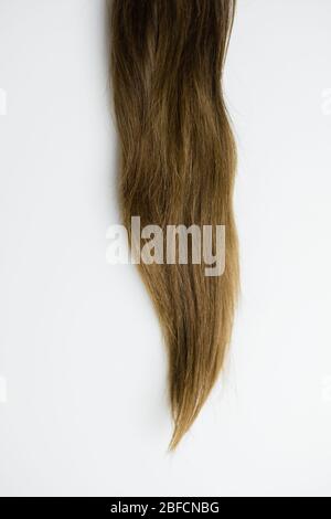 Women's long hair on a white background Stock Photo