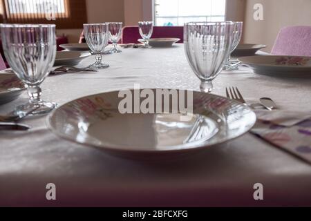 The table is served for Lunch  On the table are  glasses and Plates Stock Photo