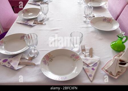 The table is served for Lunch  On the table are  glasses and Plates Stock Photo