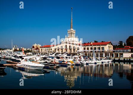 Sochi / Russia - November 04 2014: Marine Station Building and yachts, boats anchored in the port of Sochi. Russia. Stock Photo