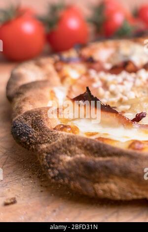Italian Pizza with tomatoes and mozzarella. The best pizza in the world from Naples. Stock Photo