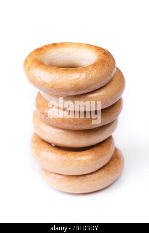 Heap of small dry bagels, bread rings isolated on white background Stock Photo