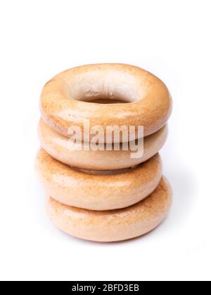 Heap of small dry bagels, bread rings isolated on white background Stock Photo