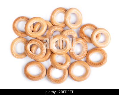 Heap of small dry bagels, bread rings isolated on white background Stock Photo