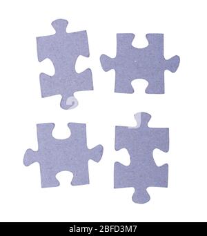Heap of puzzles pieces isolated on white background Stock Photo