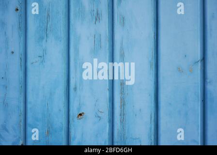Light blue pastel colour background of aged wood with vertical planks. Stock Photo