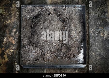 Ash tray from a wood burner Stock Photo