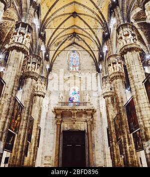 Milan, Italy circa January, 2020: Interior of Milan Cathedral known as Duomo di Milano, historical building and famous landmark in Lombardy region in Northern Italy Stock Photo