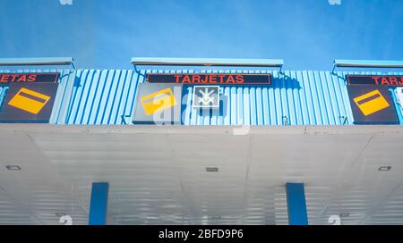 Credit card payment signals in spanish. Highway toll gate Stock Photo