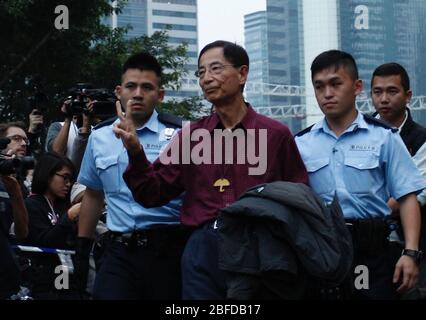 Hong Kong, China. 11th Dec, 2014. Martin Lee display V-Sign when he was arrested and escorted away from the occupied zone in Admiralty Central during OCCUPY CENTRAL-UMBRELLA REVOLUTION 2014.Hong Kong barrister and former lawmaker, a prominent political figure, Martin Lee, and media tycoon Jimmy Lai, with among others from democratic camps, Lee Cheuk Yan, Albert Ho and Leung Kwok Hung ( Long Hair ) are arrested this morning by the police authority accused of participating in a so called 'unlawful protest'.(FILE PHOTO) April-18, 2020 Hong Kong.ZUMA/Liau Chung-ren (Credit Image: © Liau Chung-re Stock Photo