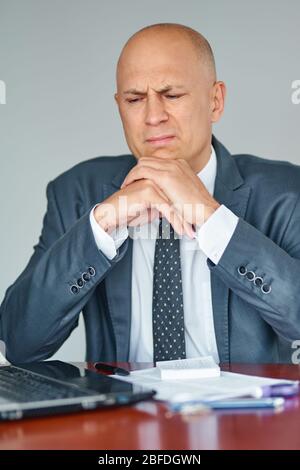 man having stressful time working on laptop Stock Photo
