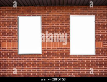 Blank/mockup billboard on a red brick wall Stock Photo